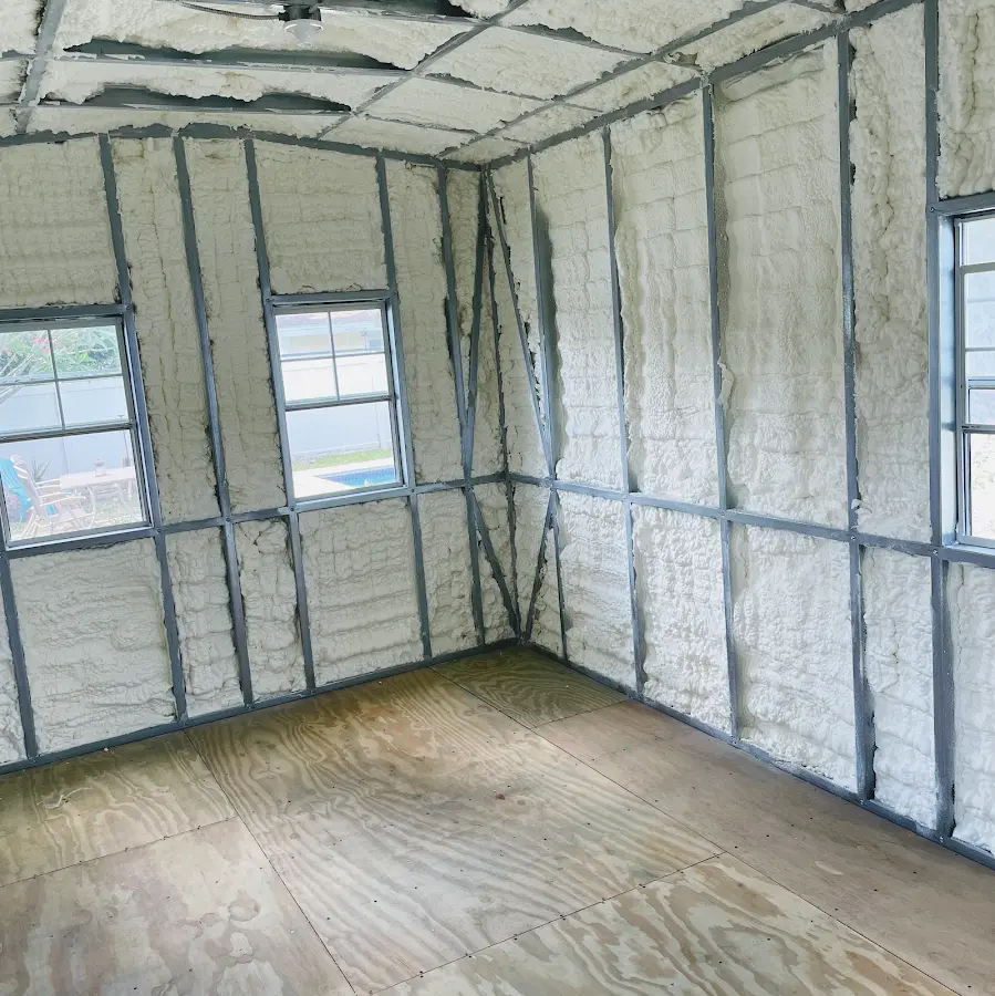 Closed-cell spray foam insulation applied to wall cavities in a residential project in Economy